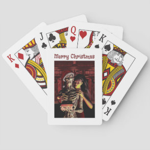 Frohe Weihnachten. Lustiges Skelett mit Frau Spielkarten