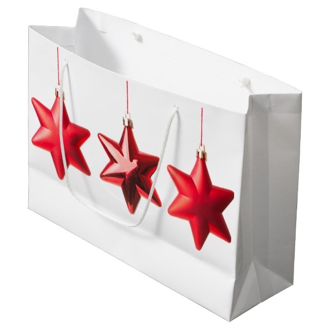 Frohe Weihnachten Rote Sterne Dekoration mit Text Große Geschenktüte (Vorderseite Schrägansicht)