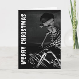 Frohe Weihnachten. Skelett mit Weihnachtsmannmütze Karte