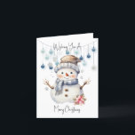 Frohe Weihnachten Snowman<br><div class="desc">Wünschen Sie jemandem ein besonderes Weihnachten mit dieser bezaubernden Karte. Ein bezaubernder Aquarellschneemann mit Hut und Schal und einem großen, fröhlichen Lächeln. Hinter ihm hängen einige blaue Bausteine an einer Kette. Oben und unten liest Wünscht Ihnen ein frohes Weihnachtsfest in einem schwarzen Skript.</div>