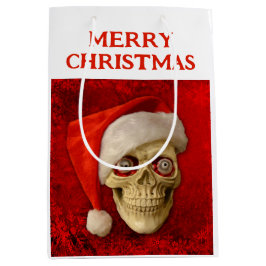 Frohe Weihnachten. Totenkopf mit Santa-Hut Mittlere Geschenktüte