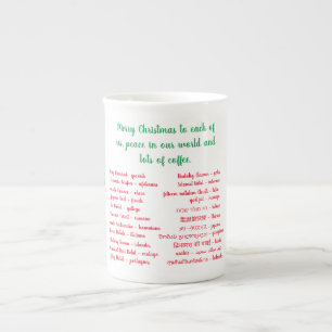 Frohe Weihnachten und Kaffee in verschiedenen Spra Prozellantasse