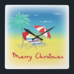 Frohe Weihnachten, Weihnachtsmannmütze, Palme Tree Quadratische Wanduhr<br><div class="desc">Frohe Weihnachten mit Weihnachtsmannmütze,  Palme Tree,  Beach Umbrella und Chair Illustration von Inge Lewis. Finden Sie weitere passende Artikel im ingeinc.com Store.</div>