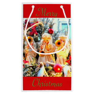 Frohe Weihnachtsangels trompelnd Kleine Geschenktüte