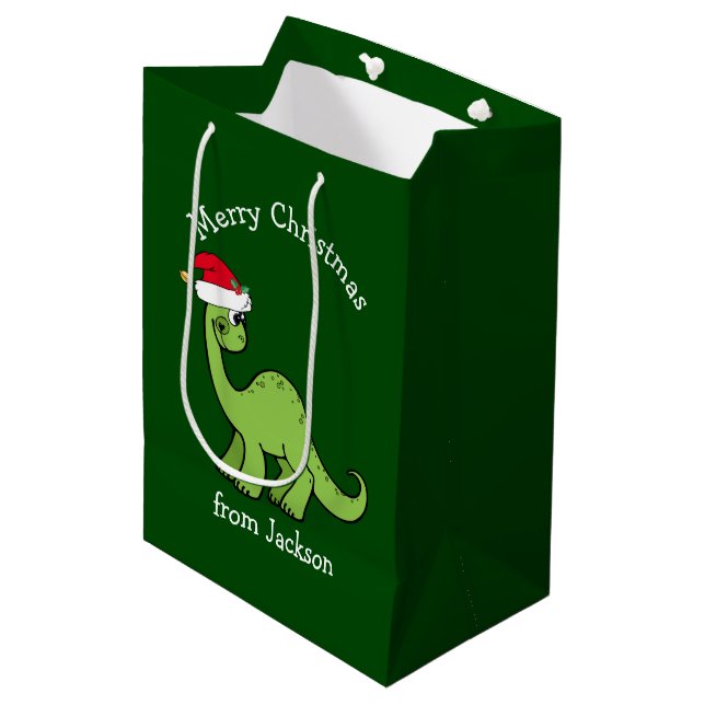 Frohe Weihnachtsdinosaurier in Weihnachtsmannmütze Mittlere Geschenktüte (Vorderseite Schrägansicht)