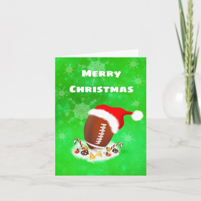 Frohe Weihnachtsfußball mit Weihnachtsmannmütze un Feiertagskarte (Vorderseite)