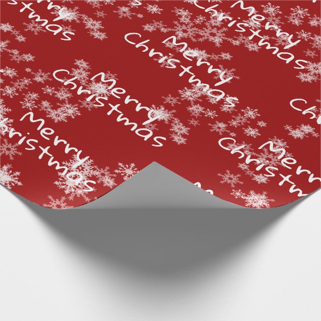 Frohe Weihnachtstext in Schneeflocken Geschenkpapier (Ecke)