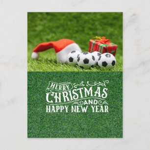 Froher Fußballurlaub mit Weihnachtsmannmütze Weihn Feiertagspostkarte