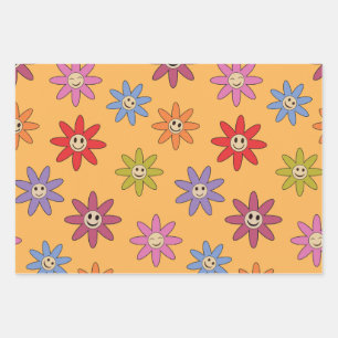 Fröhliche lächelnde bunte Blumen auf orange Geschenkpapier Set