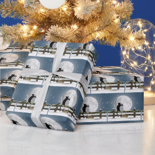 Fröhliche Weihnachtskatzen auf einem Winterzaun Geschenkpapier