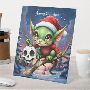 Fröhlicher Unfug – Der kleine Weihnachtself. Sockelschild