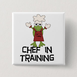Frosch-Koch in den Trainings-T-Shirts und den Button