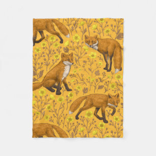 Füchse und Buttercups auf Orange Fleecedecke