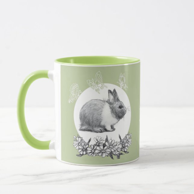 Fühl das Kaninchen. Bleistift zeichnend. Tasse (Links)