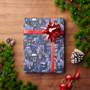 Funkelnd blaues Weihnachtsdorf mit schneebedeckten Geschenkpapier