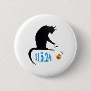 Funny Cat Swatting Orange Off Table On Election Da Button
