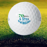 Funny Golf Balls 70. Geburtstag Golfball<br><div class="desc">Feiern Sie mit den Funny Golf Balls zum 70. Geburtstag eines Golfers im Stil. Diese Golfbälle machen jedem Golfer, der diese Meilensteinzeit erreicht, einen Spaß und ein einzigartiges Geschenk. Mit der spielerischen Aufschrift "70 Jahre und noch schwingend!" fügen diese Bälle dem Spiel eine Touch Spaß und Feiern hinzu. Ob für...</div>