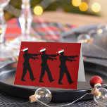 Funny Zombie Santa Christmas Red Feiertagskarte<br><div class="desc">Zombies in roten Weihnachtsmannmützen,  die mit toten Armen in Linie laufen oder sich vor ihnen ausstrecken. Eine lustige Urlaubskarte für einen Horror-Fan zu Weihnachten.</div>