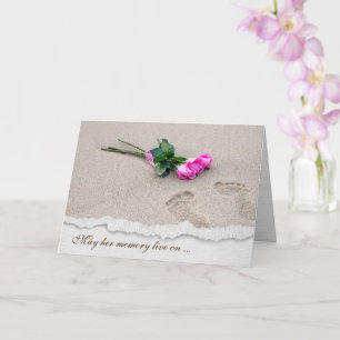 Fußabdrücke und Rose auf Sand Karte