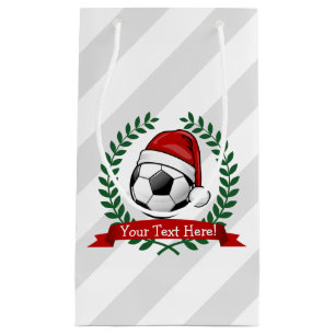 Fußball-Ball, der ein Kleine Geschenktüte