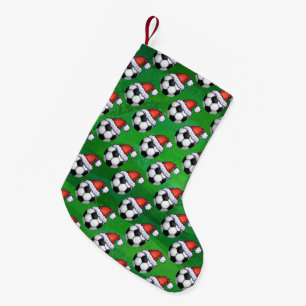 Fußball-Ball-Weihnachtsmannmütze auf Grün Kleiner Weihnachtsstrumpf