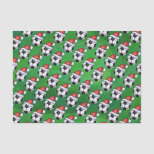 Fußball-Ball-Weihnachtsmannmütze auf Grün Seidenpapier