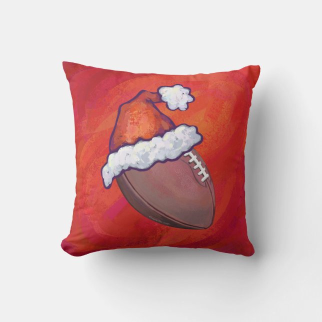 Fußball in Weihnachtsmannmütze über Rot Kissen (Vorderseite)