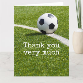 Fußball mit Wort Danke, auf grünem Gras Dankeskarte