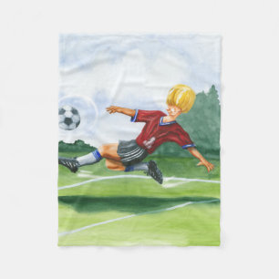 Fußball-Spieler, der einen Ball durch Jay Fleecedecke