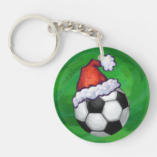 Fußball-Weihnachtsmannmütze auf Grün Schlüsselanhänger