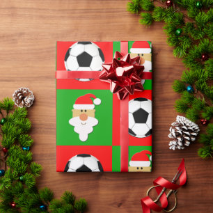 Fußbälle u. rotes u. grünes Weihnachten Geschenkpapier