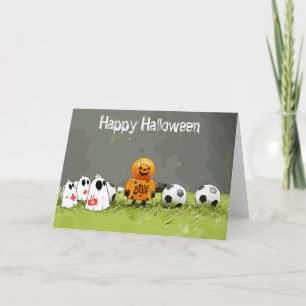 Fußballfröhliches Halloween mit Bälle auf grünem G Karte