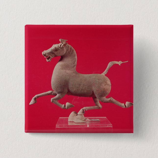 Galoppierendes Pferd mit einem Huf, der auf a Button (Vorderseite)