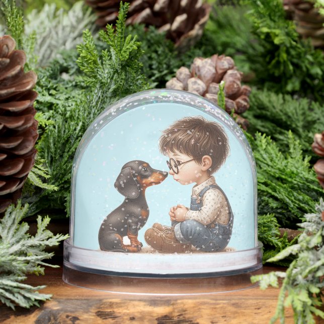 Garçon et chiot Dachshund (Hiver)