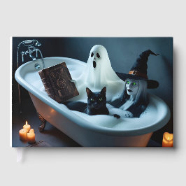 Gästebuch in Badewanne und schwarze Katze in Bubbl