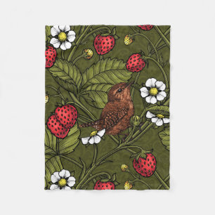 Gebärde und Erdbeeren auf dunkelgrün Fleecedecke