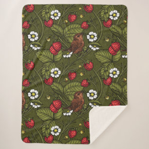 Gebärde und Erdbeeren auf dunkelgrün Sherpadecke