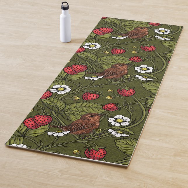 Gebärde und Erdbeeren auf dunkelgrün Yogamatte (Beispiel)