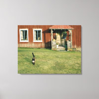 Gebrotes Haus mit einer Katze auf dem Rasen.