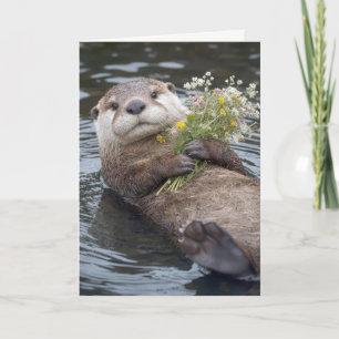 Geburtstagsotter, der mit einem Wildblumenstrauß s Karte