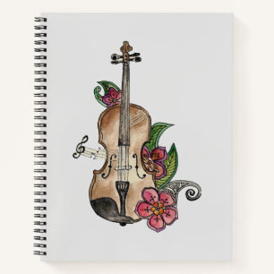 Geige mit Blumendesign auf einem Notizbuch / Tageb