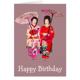 Geisha japonais avec l'anniversaire rose de kimono