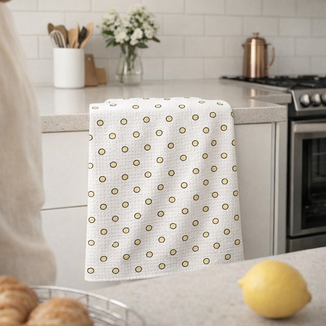 Gelb-schwarzes Kreis-Muster Geschirrtuch (A kitchen towel with a pattern of yellow and black dots)