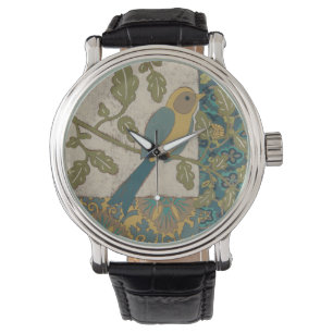 Gelb und aquamariner blauer Vogel gehockt auf Armbanduhr