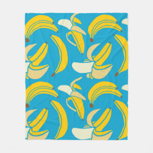 Gelbe Bananen, blaues Hintergrundmuster Fleecedecke