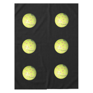 Gelbe Golfbälle auf schwarz, Tischdecke