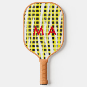 Gelbe schwarze Schachbrettmuster tragen den Namen Pickleball Schläger
