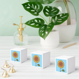Gelbe Sonnenblume auf Geschenkschachtel