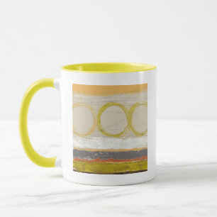 Gelbe u. orange Kreise auf mehrfarbigem Tasse
