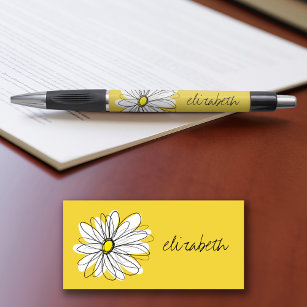 Gelbe und weiße weiße, weißliche Daisy mit benutze Kugelschreiber